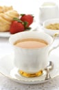 Tea with cruller and strawberries Royalty Free Stock Photo