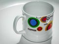 Tea cup and coffee mug with colourful designing and white colour.