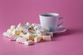 Tea cup with colored marshmallow Royalty Free Stock Photo