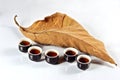 Tea cup with dried leaf