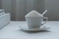 Tea cup full of white sugar Royalty Free Stock Photo