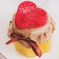 Tea cup with heart shaped biscuits. Sugar red biscuits. A square, equal sides. Instaphoto with filters