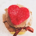 Tea cup with heart shaped biscuits. Sugar red biscuits. A square, equal sides. Instaphoto with filters