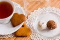 Tea cup with heart shaped biscuits. Sugar red biscuits. Royalty Free Stock Photo