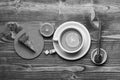 Tea cup with honey and piece of cake making cozy composition, top view. English tea time concept. Cup of green tea with