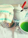 Tea cup illustration, cup of tea from natural herbs,a cup of green tea, a bowl of sugar and Grandma`s jars with natural herbs, flo