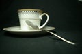 Tea cup and large Spoon black Background soft lighst Royalty Free Stock Photo