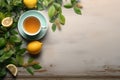 Tea cup and and mint leaves on wooden background. Top view. Cup of tea on table with lemon and green leaves, tea drink