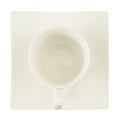 Tea cup over a square plate isolated Royalty Free Stock Photo