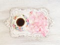 Tea cup with peony petals Royalty Free Stock Photo