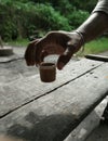 Tea in cup picking up by hand Royalty Free Stock Photo