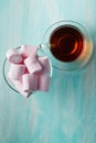 Tea cup and pink marshmallows