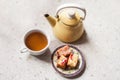 Tea cup, tea pot and freshly baked sponge cake