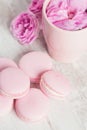 Tea cup with rose and pink macaroons Royalty Free Stock Photo