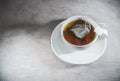 Tea cup on saucer with bag. Top view. Teabag in teacup Royalty Free Stock Photo