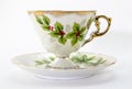 Tea cup and saucer with Christmas holly printed Royalty Free Stock Photo