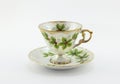 Tea cup and saucer with Christmas holly printed Royalty Free Stock Photo