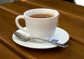 Tea, cup, spoon, wood, table Royalty Free Stock Photo