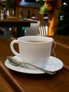 Tea, cup, spoon, wood, table Royalty Free Stock Photo