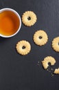 Tea in cup and tasty shortbread cookies