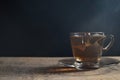 Tea cup with tea bag on old wood. Summer tea time Royalty Free Stock Photo