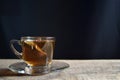 Tea cup with tea bag on old wood. Summer tea time Royalty Free Stock Photo