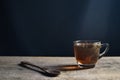 Tea cup with tea bag on old wood. Summer tea time Royalty Free Stock Photo