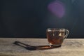 Tea cup with tea bag on old wood. Summer tea time Royalty Free Stock Photo