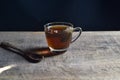 Tea cup with tea bag on old wood. Summer tea time Royalty Free Stock Photo