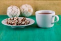 Tea in a cup and wafer tubules in a plate Royalty Free Stock Photo