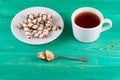 Tea in a cup and wafer tubules in a plate Royalty Free Stock Photo