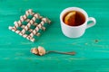 Tea in a cup and wafer tubules in a plate Royalty Free Stock Photo