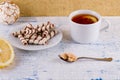 Tea in a cup and wafer tubules in a plate Royalty Free Stock Photo