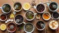 Tea cups are arranged on a wooden surface featuring a variety of Royalty Free Stock Photo