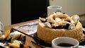 Tea cups mugs with two dessert cake tarts on wooden table at home