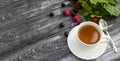 Tea with currant leaves in a cup Royalty Free Stock Photo