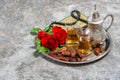 Tea, dates fruits, red rose flower, holy book quran and rosary. Royalty Free Stock Photo