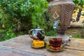 Tea drinking from a vintage samovar with oriental sweets Royalty Free Stock Photo