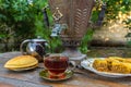 Tea drinking from a vintage samovar with oriental sweets Royalty Free Stock Photo