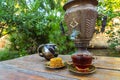 Tea drinking from a vintage samovar with oriental sweets Royalty Free Stock Photo