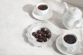 Tea drinking. White teapot with cups and a set of chocolates Royalty Free Stock Photo