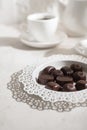 Tea drinking. White teapot with cups and a set of chocolates Royalty Free Stock Photo