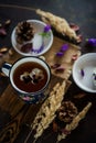 Tea with edible flowers, pansies. The concept of a cozy home autumn tea party Royalty Free Stock Photo