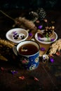 Tea with edible flowers, pansies. The concept of a cozy home autumn tea party Royalty Free Stock Photo