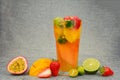 tea with fruits in a glass, mango, passion fruit, strawberry, lenon, watermelon, cut