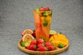 tea with fruits in a glass, mango, passion fruit, strawberry, lenon, watermelon, cut