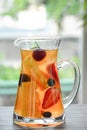 tea with fruits in a glass, pineapple, strawberry, blueberry