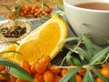 Tea with fruits of sea buckthorn and oranges