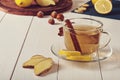 Tea with ginger, lemon and cinnamon sticks Royalty Free Stock Photo