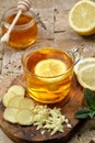 Tea ginger and lemon on rustic stone table Royalty Free Stock Photo